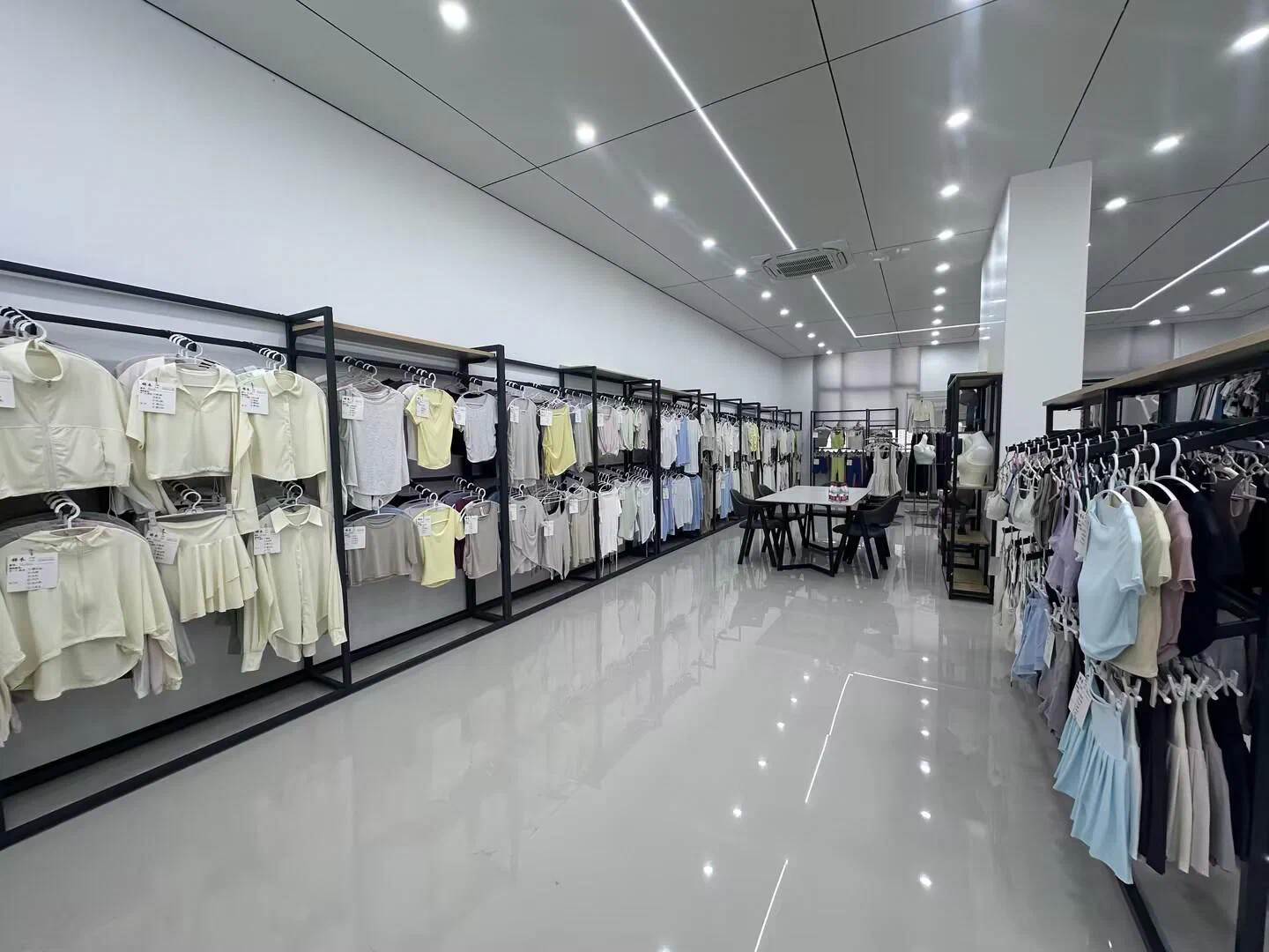 Spacious and clean showroom of the dancewear factory with clothes racks